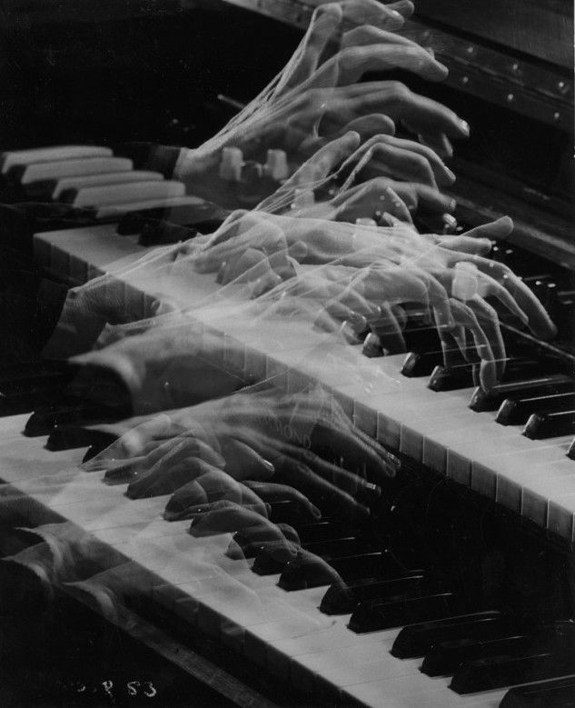 Hands playing piano